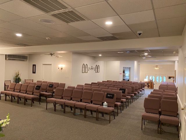 A large room with rows of chairs in it