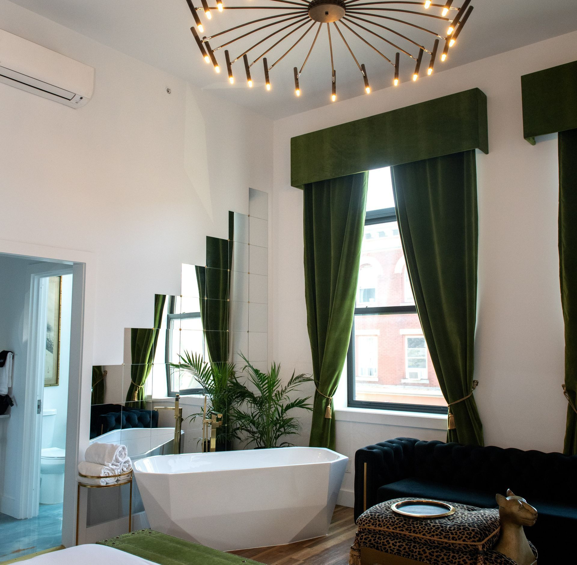 A woman is getting a facial massage at a spa.