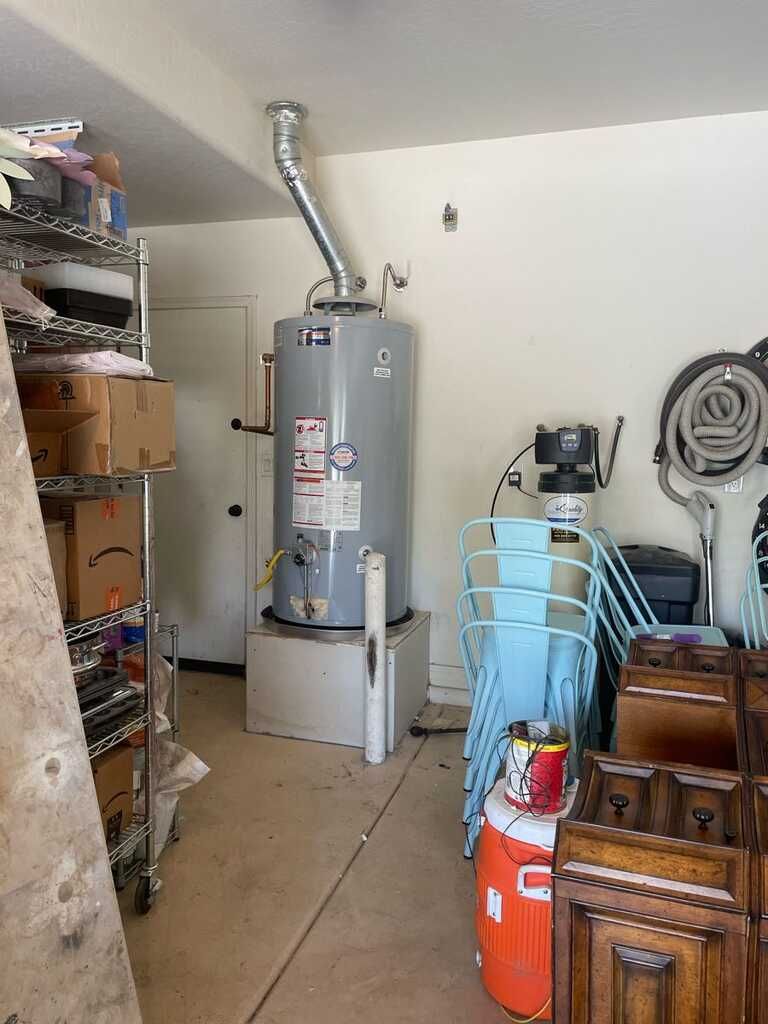 There is a water heater in the middle of the room.