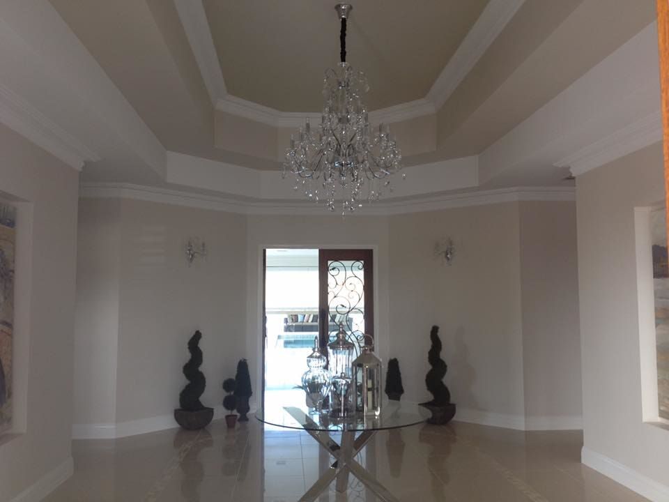 A Large Room With A Chandelier Hanging From The Ceiling — GJT Electrical In Warners Bay, NSW