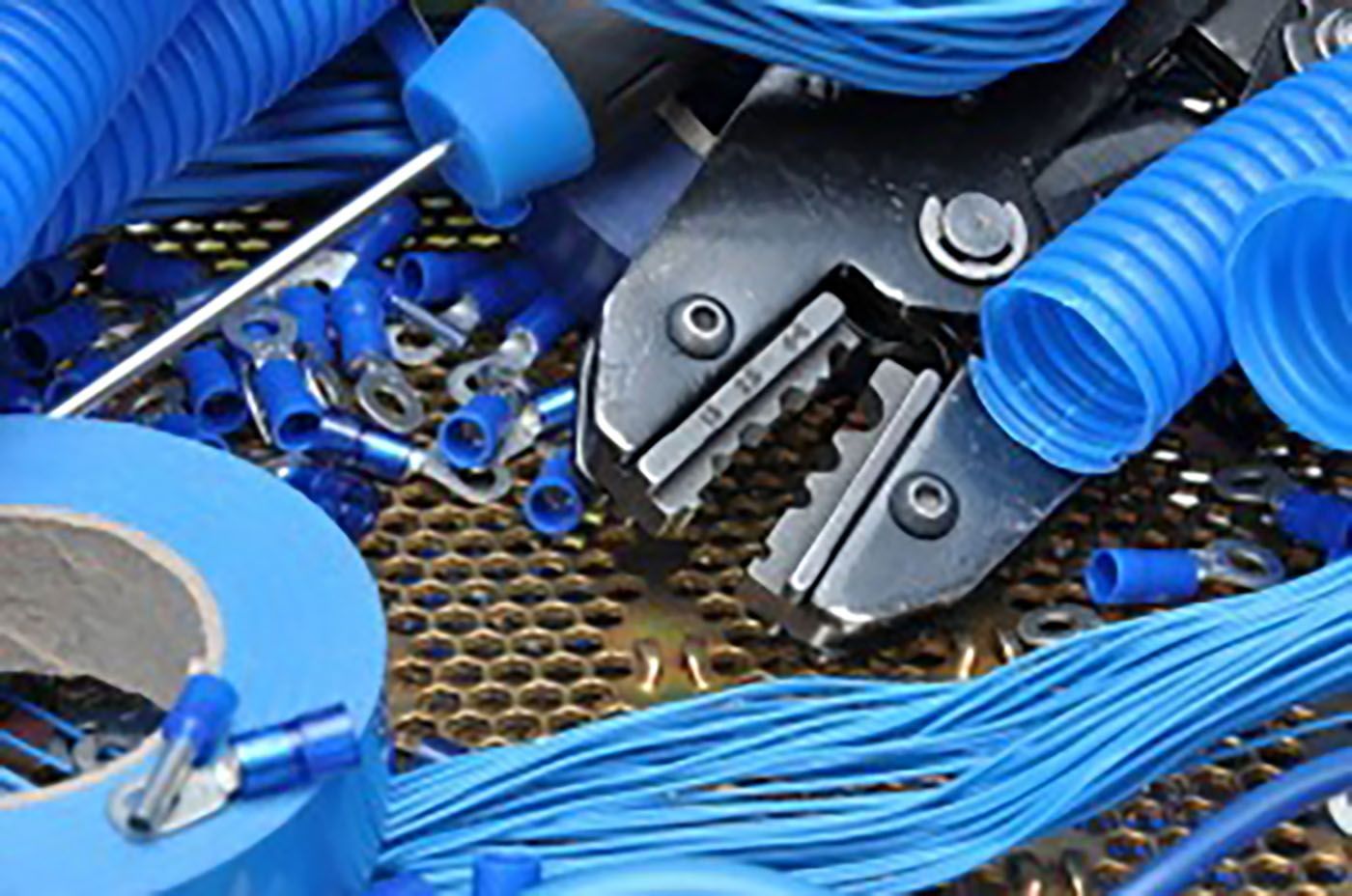 A Bunch Of Blue Wires And Tools Are On A Table — GJT Electrical In Warners Bay, NSW