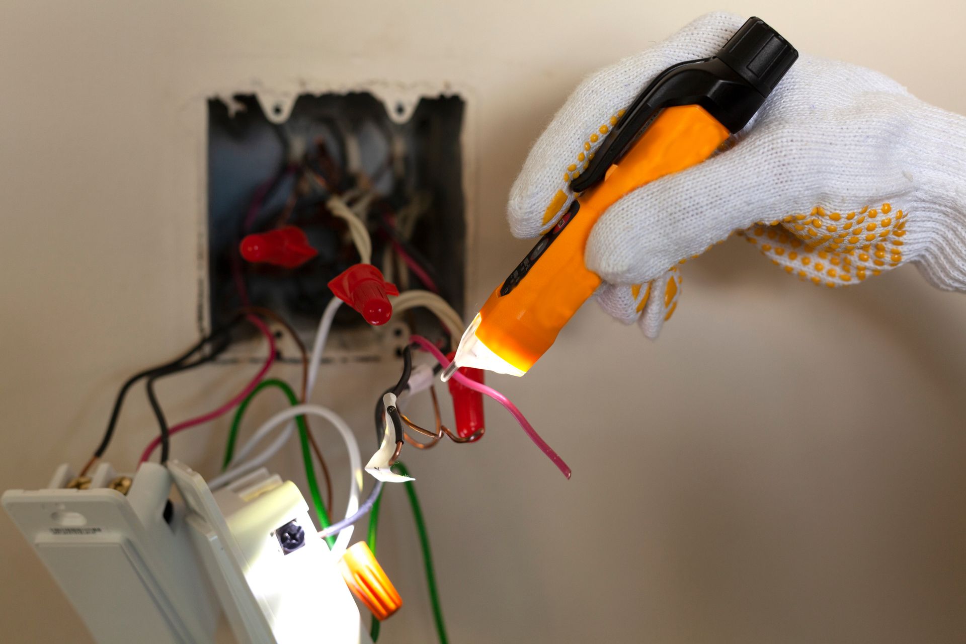 Delta Electrical Solution worker performing residential electrical repair by replacing a wall switch