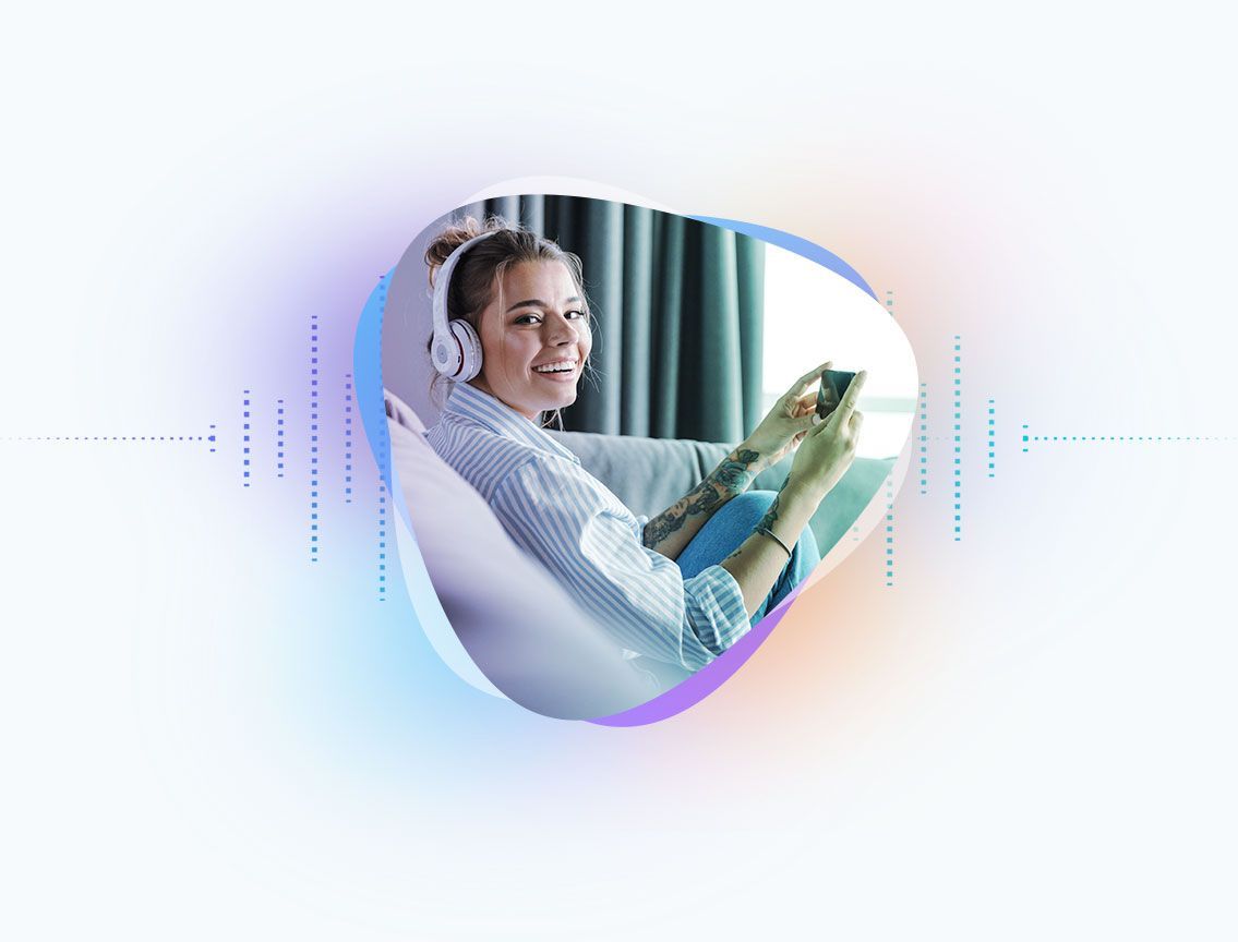 Woman with headphones smiles while holding a tablet on a couch, surrounded by a colorful digital graphic.