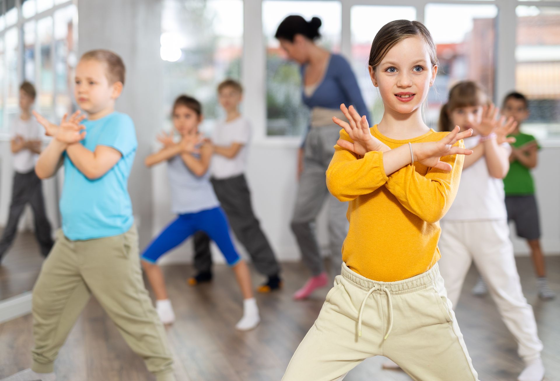 Group of boys and girls rehearsing hip hop dance in studio Group of boys and girls rehearsing hip hop dance in studio
