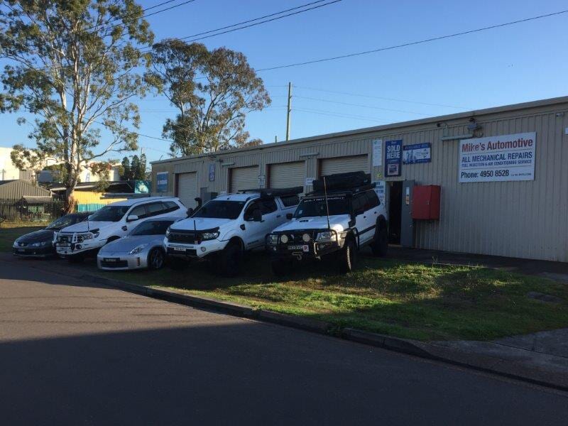 Cars Parked in front of the Garage  — Automotive in Edgeworth, NSW