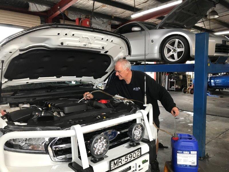 Mechanic Checking the Engine — Automotive in Edgeworth, NSW