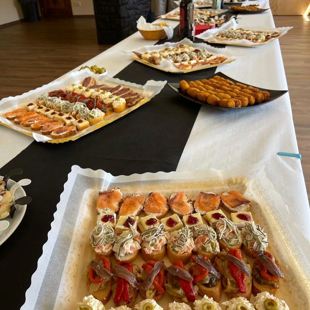 A long table with a variety of food on it