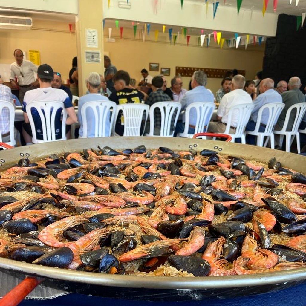 A large pan filled with shrimp mussels and rice