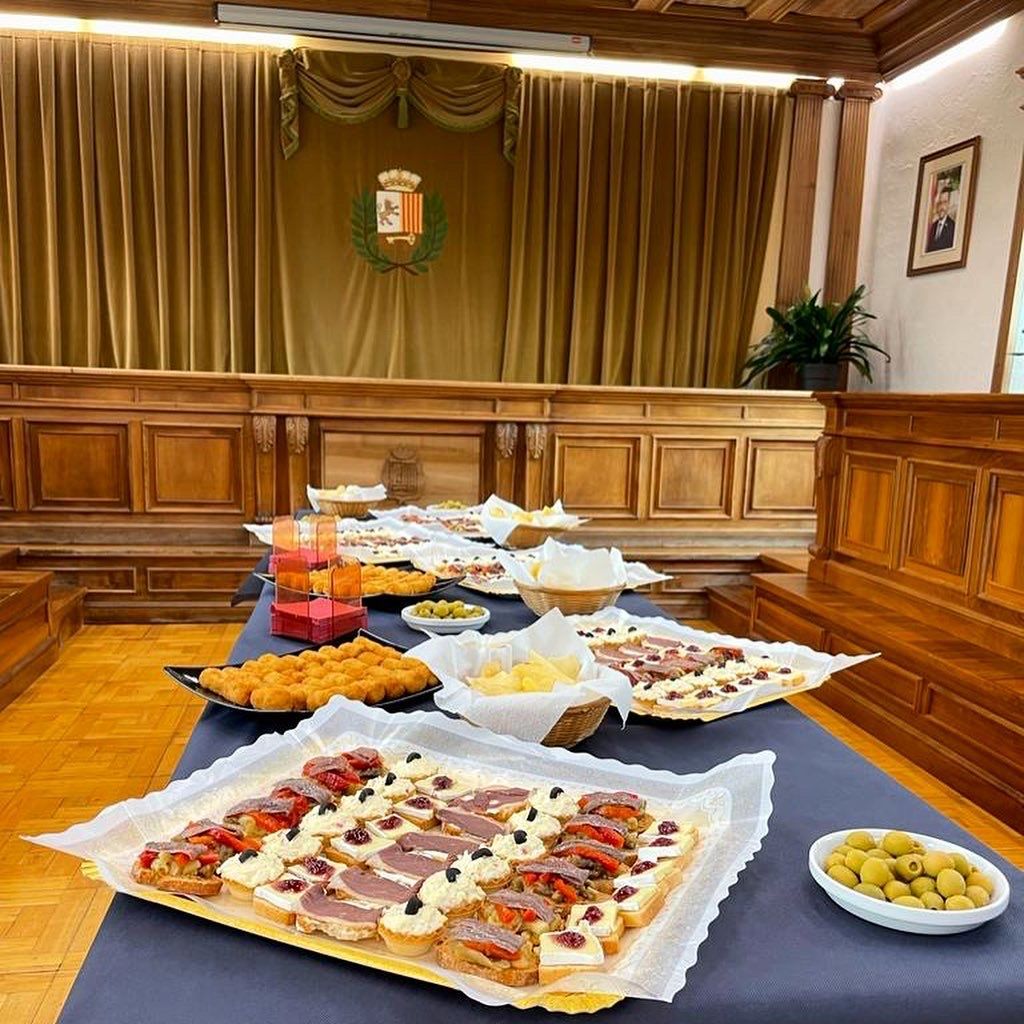 A table with a variety of food on it in a courtroom.