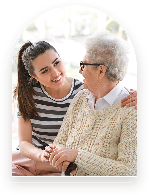 a woman reassuring an elderly woman