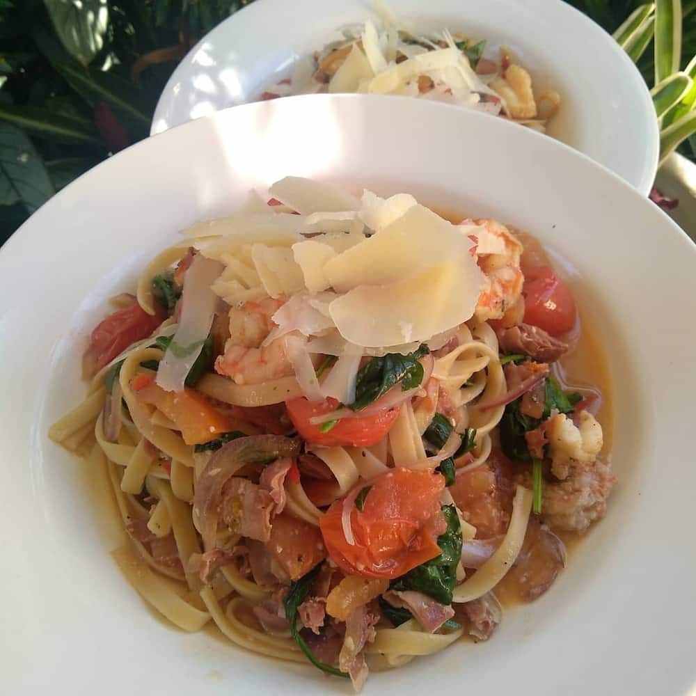 Two Bowls Of Pasta With Shrimp And Cheese On Top — Vines at 139 in Grafton, NSW