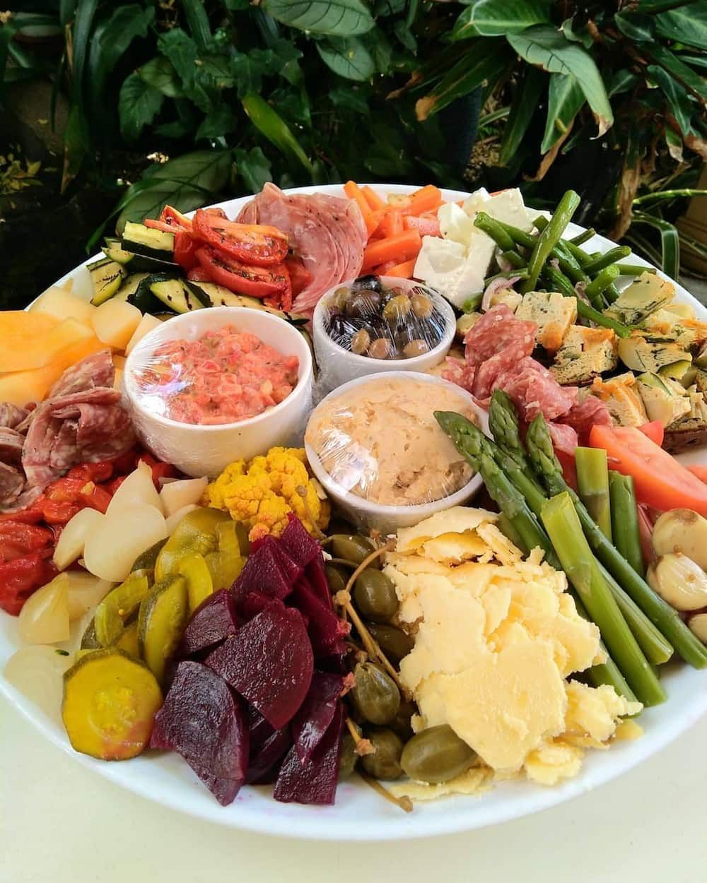 A White Plate Topped With A Variety Of Vegetables And Meats — Vines at 139 in Grafton, NSW