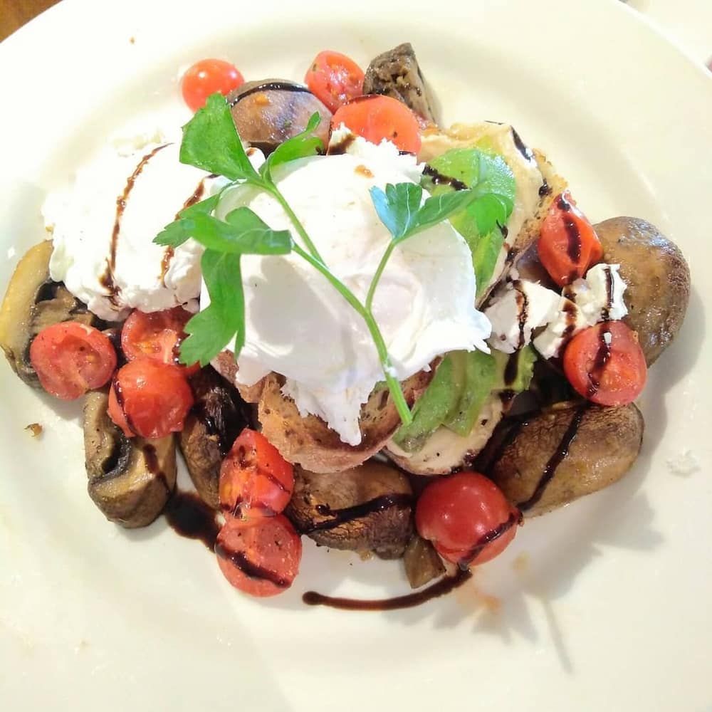 A White Plate Topped With Vegetables And Whipped Cream — Vines at 139 in Grafton, NSW