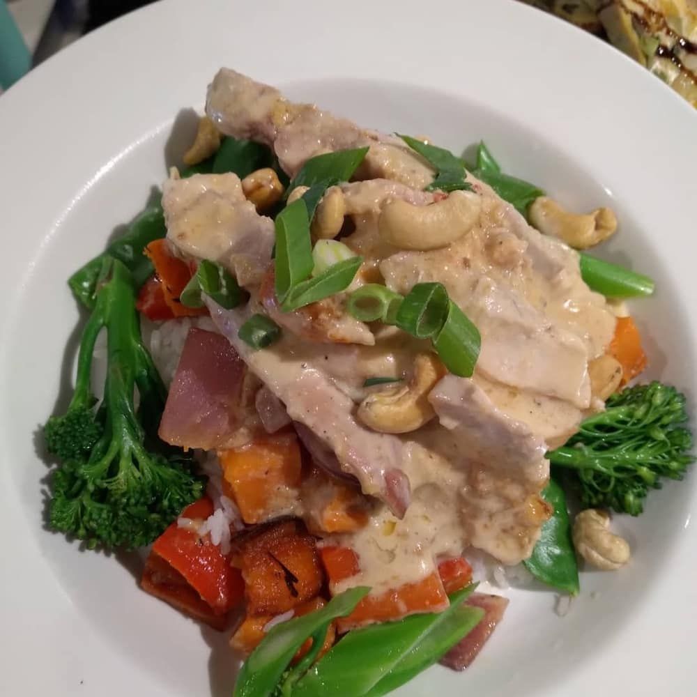 A Plate Of Food With Broccoli Carrots And Cashews — Vines at 139 in Grafton, NSW