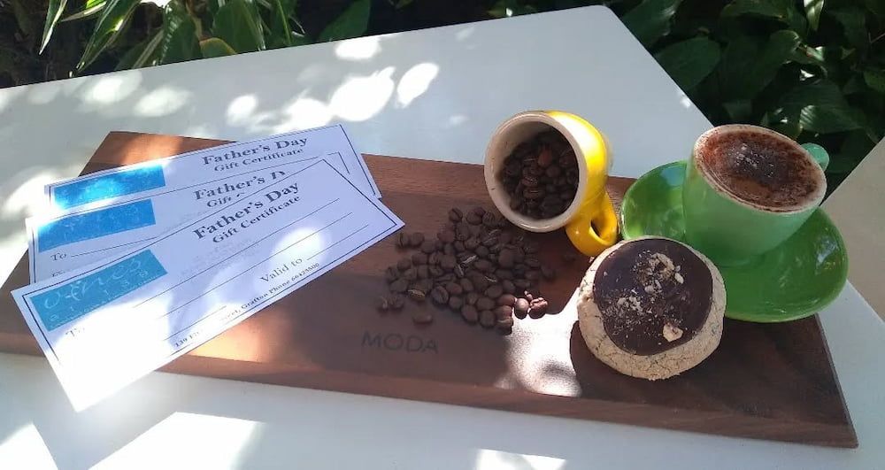 Two Cups Of Coffee On A Saucer Next To A Piece Of Paper That Says Father 's Day — Vines at 139 in Grafton, NSW