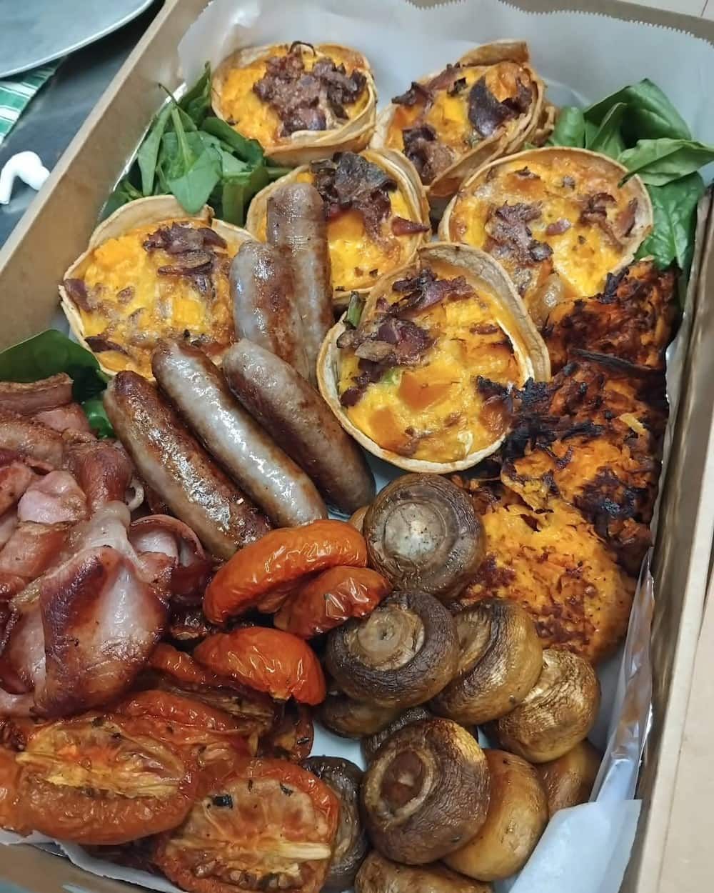 A Platter with Mini Quiches, Sausages, Bacon, Mushrooms, Tomatoes, and a Hash Brown Dish — Vines at 139 in Grafton, NSW