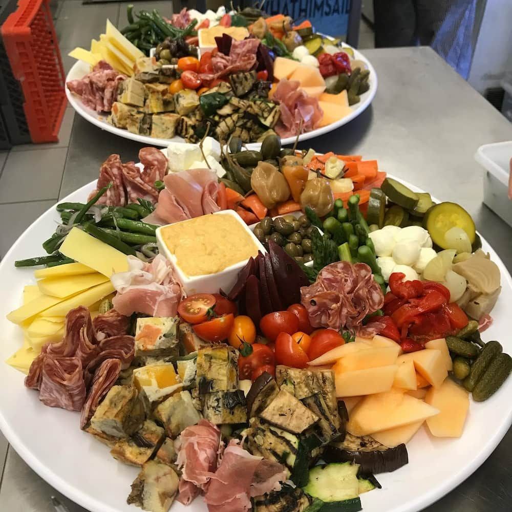 Two Plates Of Food With Meats And Vegetables On Them — Vines at 139 in Grafton, NSW