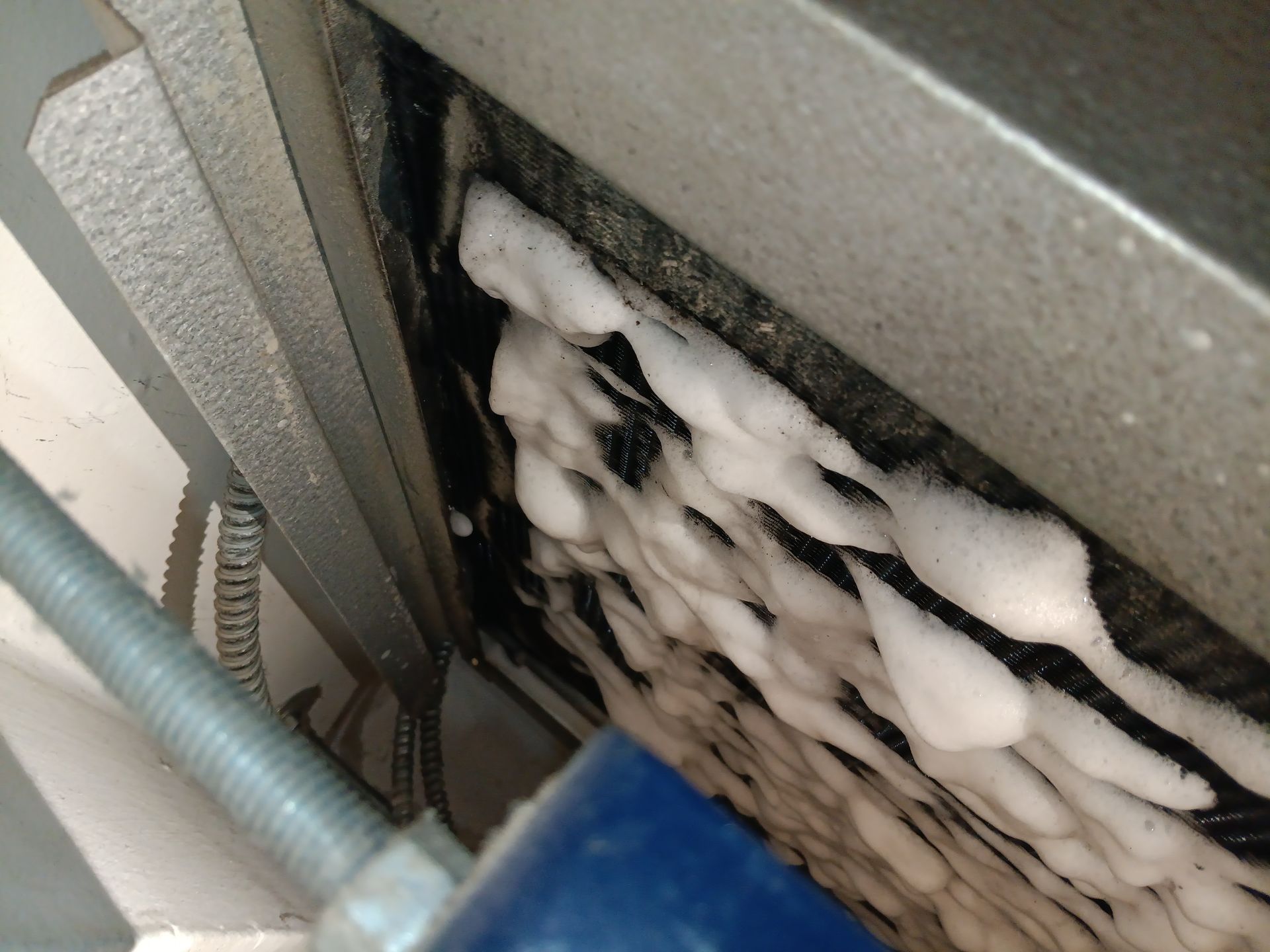 A close up of a machine with foam on it