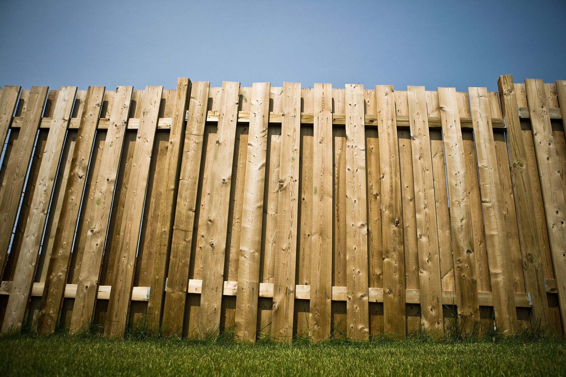 View of a wooden privacy fence, showcasing quality work by a residential fence contractor.