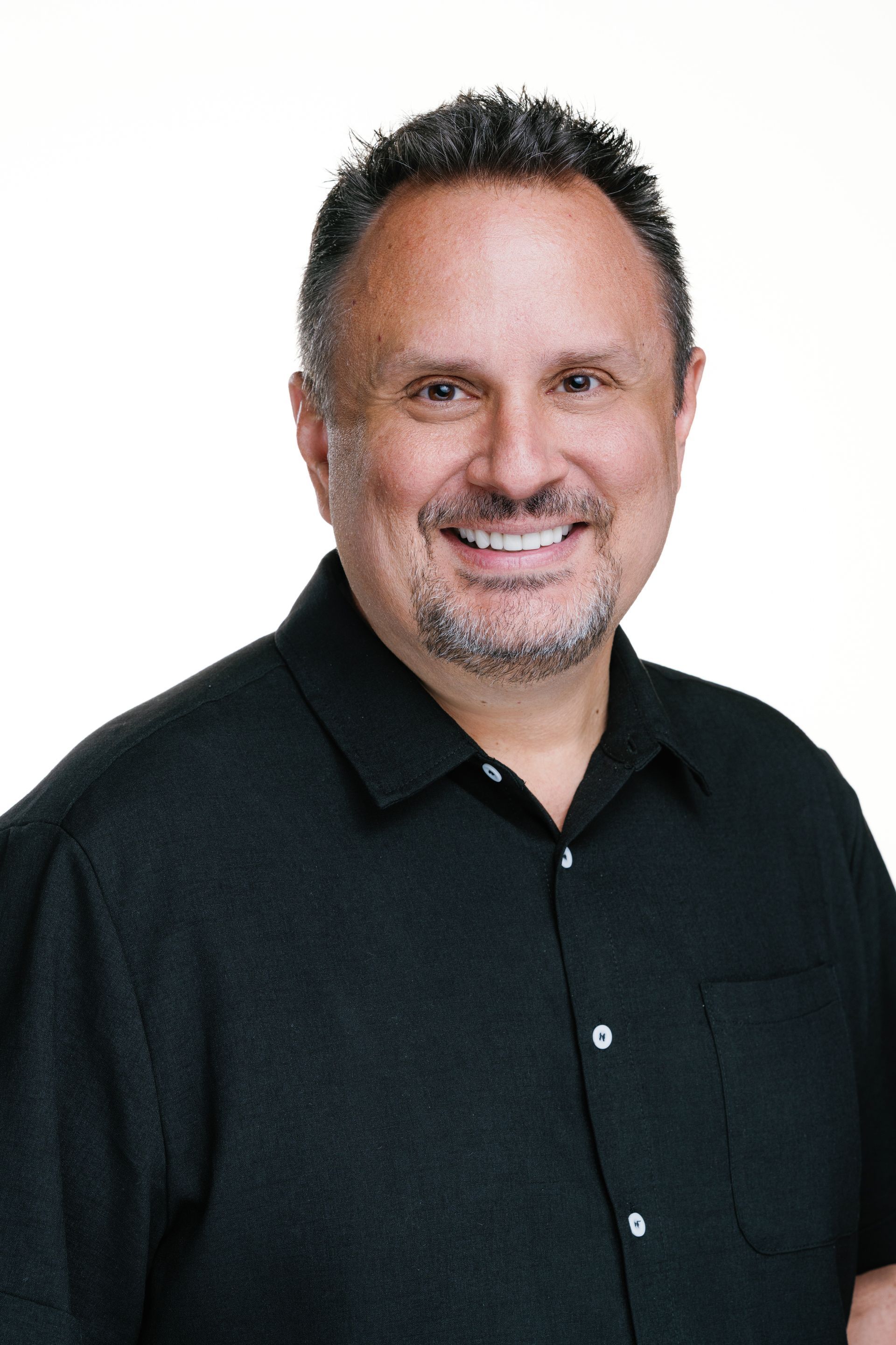 A man smiling and enjoying life.