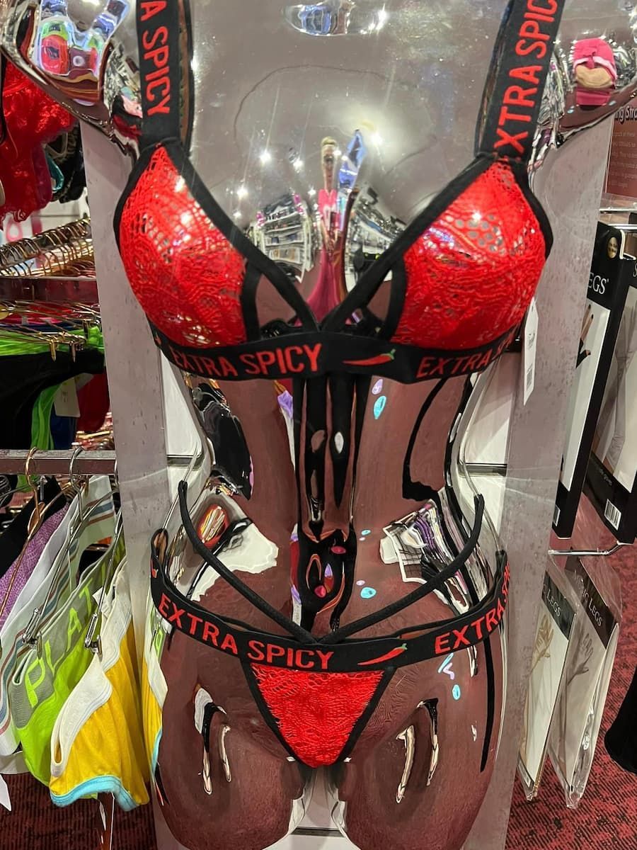 A Mannequin Is Wearing a Red and Black Lingerie Set — Laneway Adult Shop in Tully, QLD