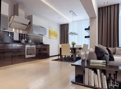 Cozy living room with red furniture, fireplace, and beige walls, connected to dining area.