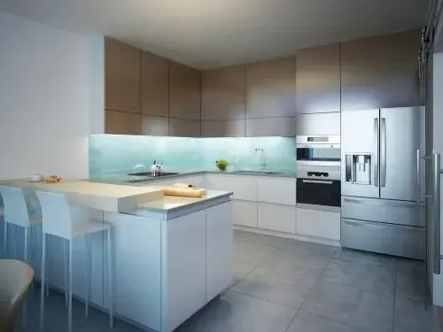 Beige sectional sofa in a living room with a TV, bookshelf, and artwork on the wall.