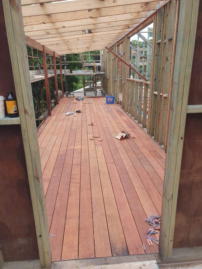 A View of a Wooden Deck Through a Doorway — Offcut Carpentry In Tweed Heads, NSW