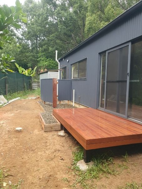 A Small House With a Wooden Deck in Front of It — Offcut Carpentry In Murwillumbah, NSW