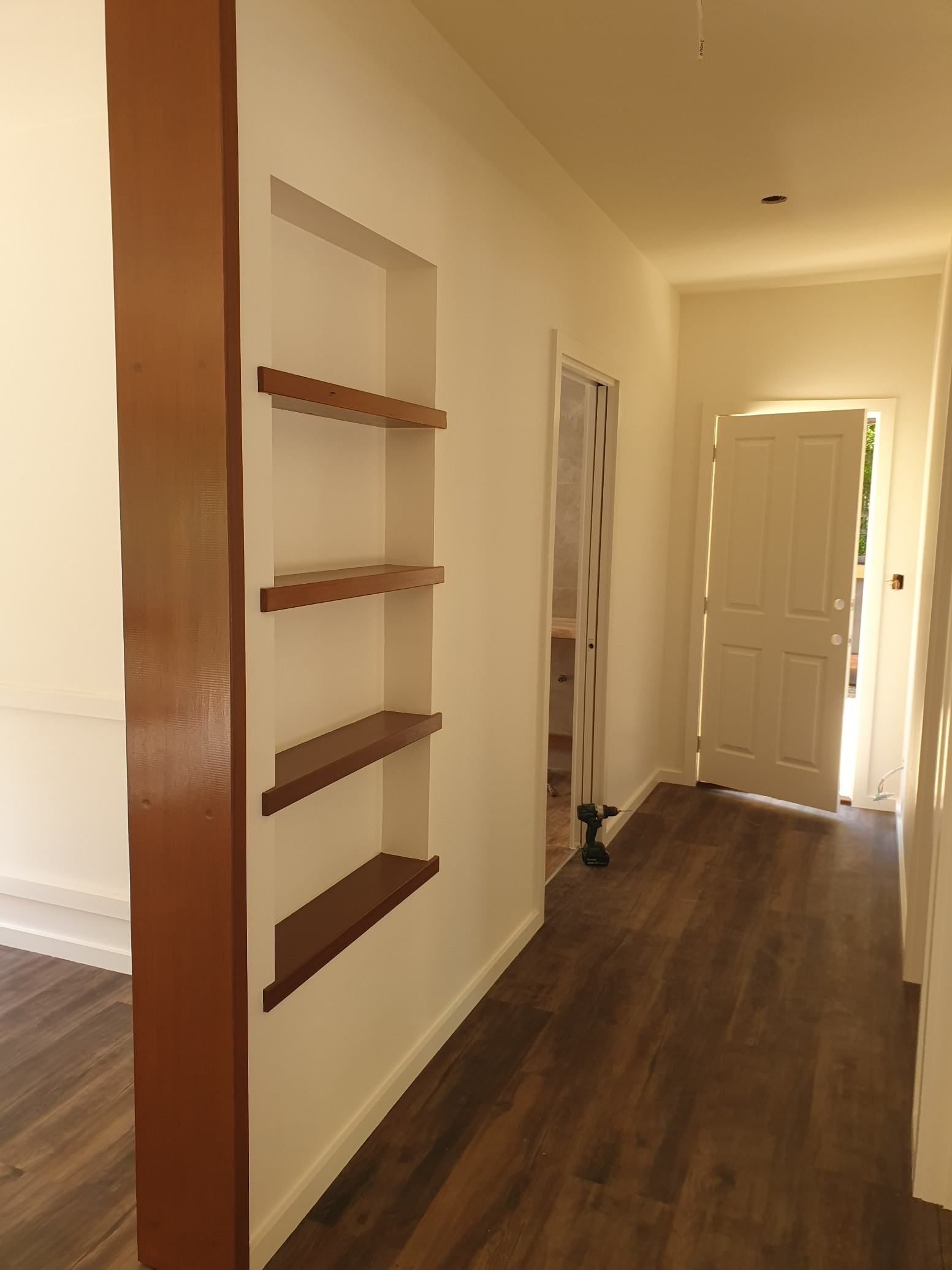 An Empty Hallway With Shelves and a Door — Offcut Carpentry In Tweed Heads, NSW
