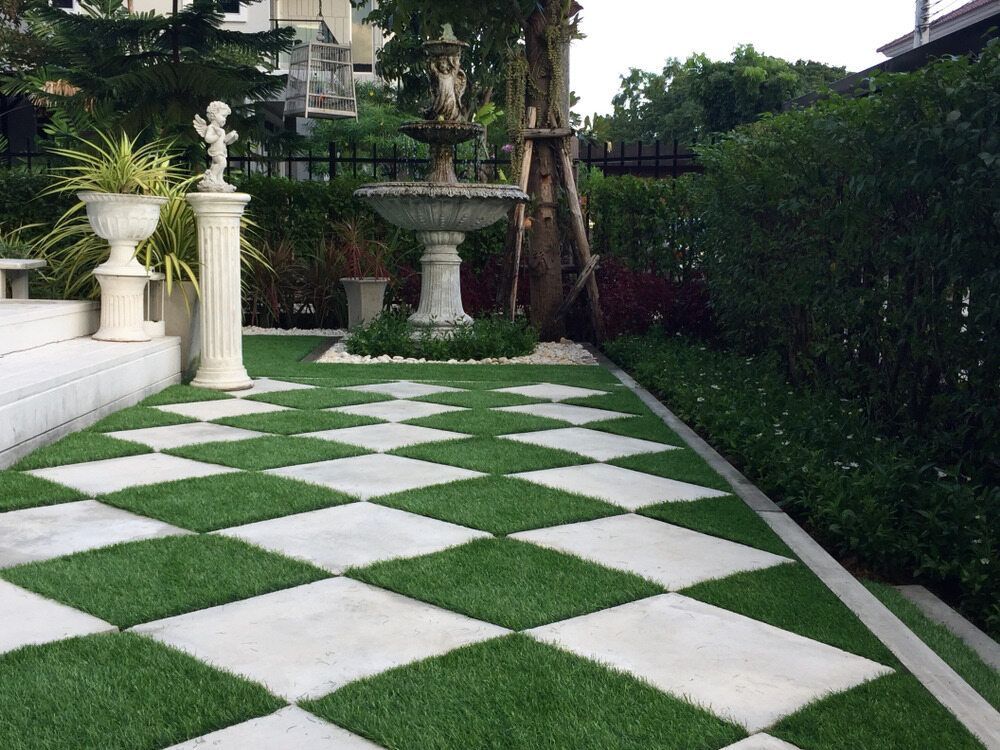 A Garden With a Checkered Floor and a Fountain — Offcut Carpentry In Tweed Heads, NSW