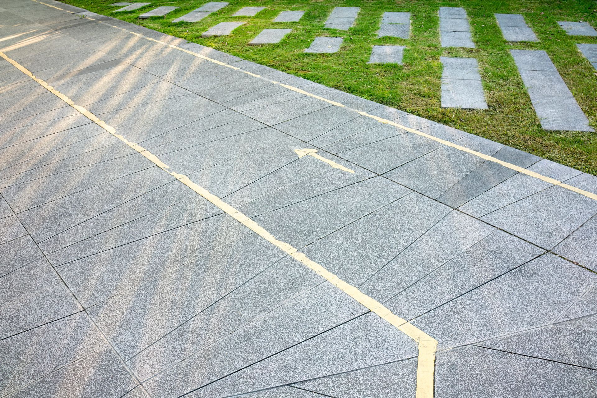 Modern paved walkway and driveway installed by expert residential paving contractor.