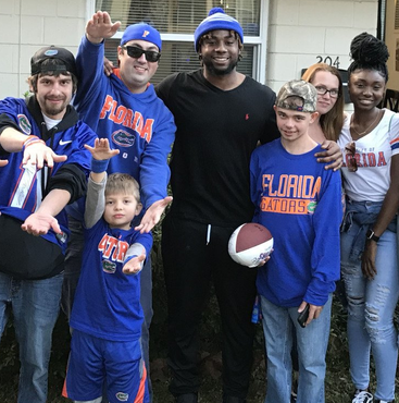 close up of Austin with community of gator fans
