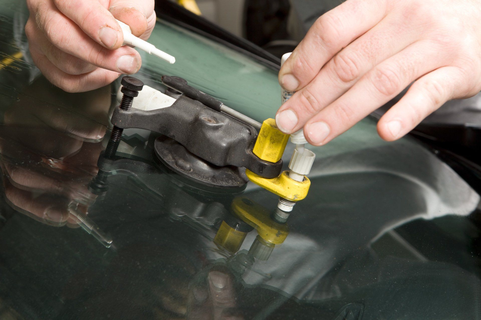 Windshield Replacement  — Man Fixing Windshield in Lenoir, NC