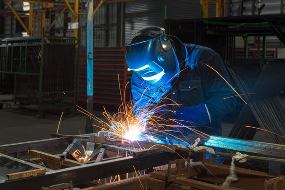 Worker Welding Steel — Memphis, TN — Industrial Machine & Fabrication, Inc.