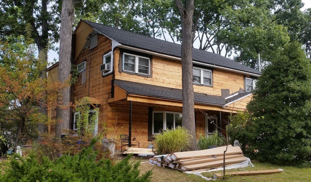 House with Wooden Siding and Asphalt Shingle Roof — Hackensack, NJ — Classic Remodeling
