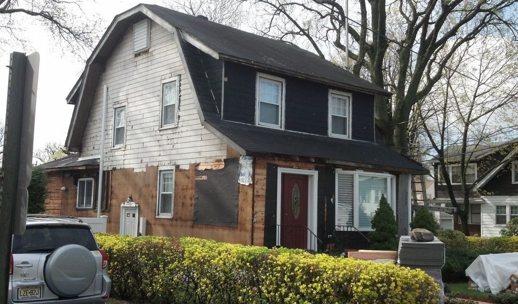 House with Black Asphalt Shingle Roof — Hackensack, NJ — Classic Remodeling