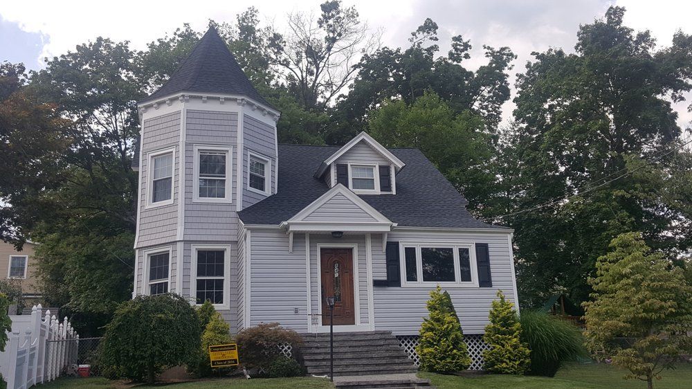 Black Shingle Roof of a House — Hackensack, NJ — Classic Remodeling