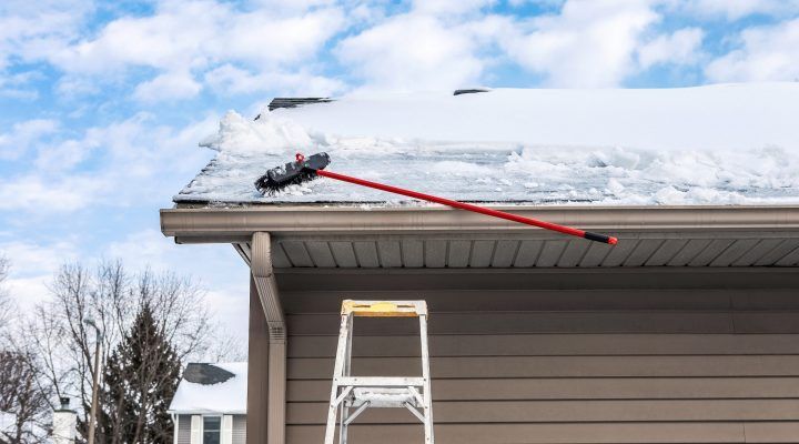 Gutter with Ice Dam and Broom — Hackensack, NJ — Classic Remodeling