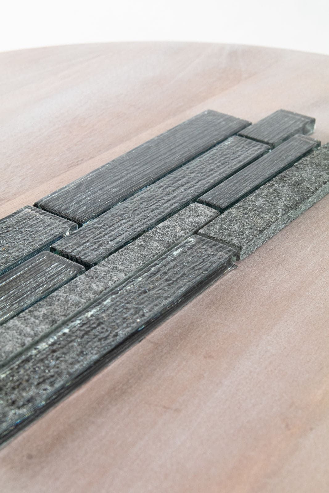 Black Forest tile featuring deep veining and rich black tones, perfect for moody kitchen or bath accents.