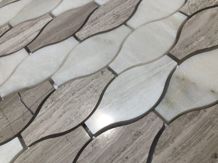 An artful interplay of marble tones and patterns, Nordic Diamond Mix adds luxe geometry to any surface.