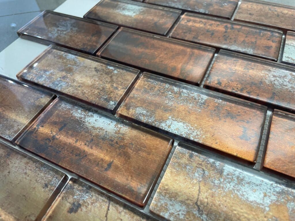 Copper Subway Glass mosaic tile with metallic copper finish, perfect for bold accent walls and backsplashes.