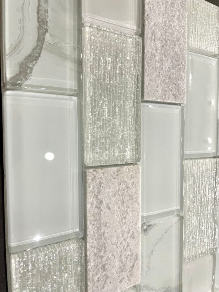 Astoria Squares tile with textured natural stone look, great for accent walls and shower designs.