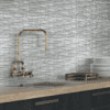 Aosta brick-patterned mosaic tile in neutral shades, perfect for contemporary bathroom walls and kitchen accents.