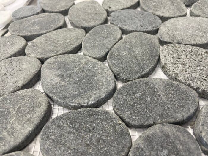 Black Lava Jumbo Stone mosaic tile with textured dark stone, ideal for bold floors or statement walls.