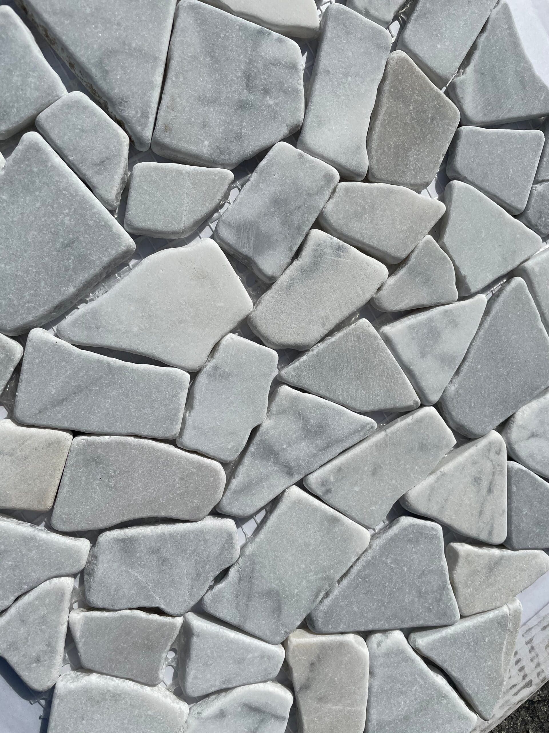 Carrara Tumbled Verona Pebble mosaic tile with smooth white and gray stones, ideal for spa-style floors and walls.