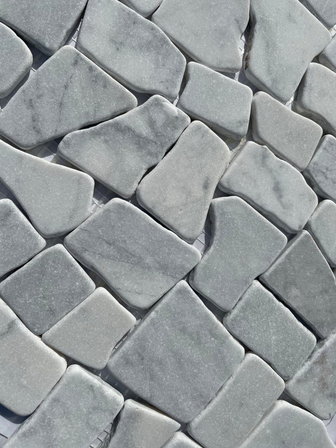 Carrara Monza Pebble Stone tile with blocky pebble shapes, perfect for natural accent walls and floors.
