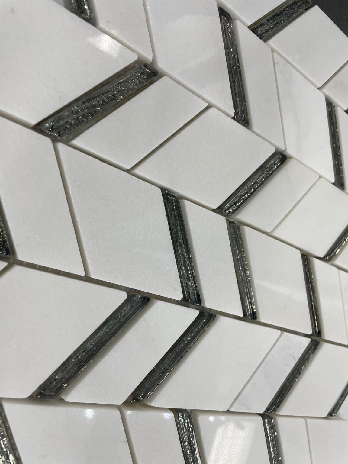 Chelsea White mosaic tile with polished white and black dolomite pieces, ideal for sophisticated wall designs.