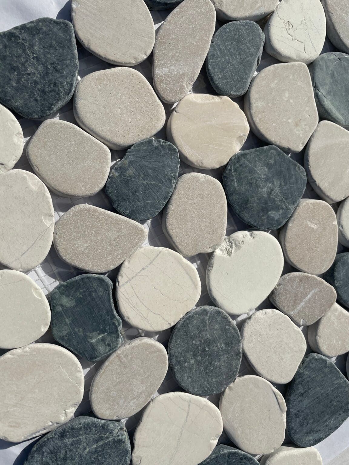 Corsica Flat Pebble mosaic tile with smooth natural stones in earthy tones, ideal for bathroom floors and walls.
