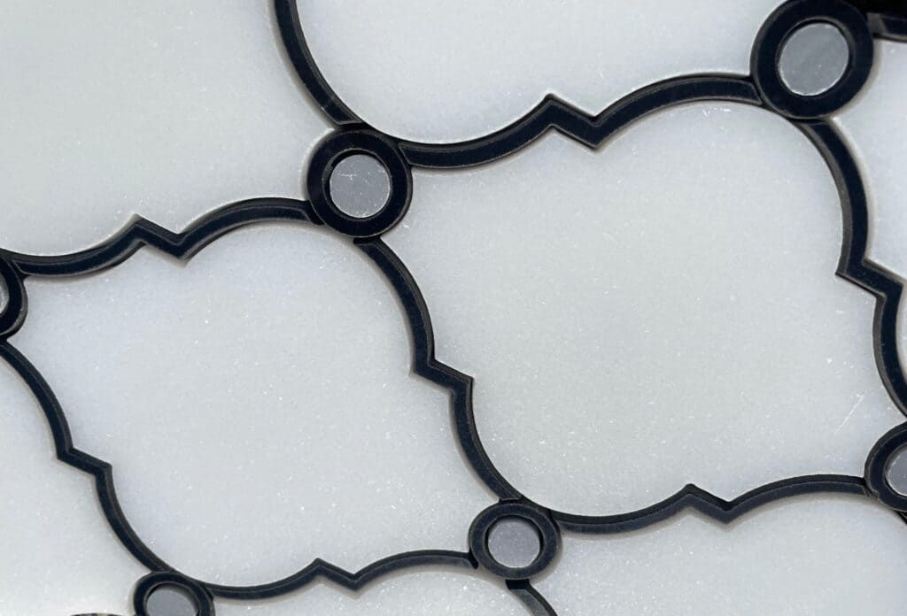 Polished white stone mosaic with black trimming in arabesque pattern, suitable for walls and wet areas.